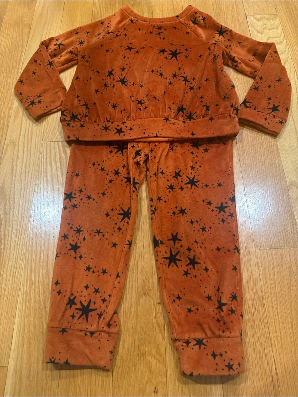 Cat & Jack rust orange velour set with black star pattern size xsmall.
